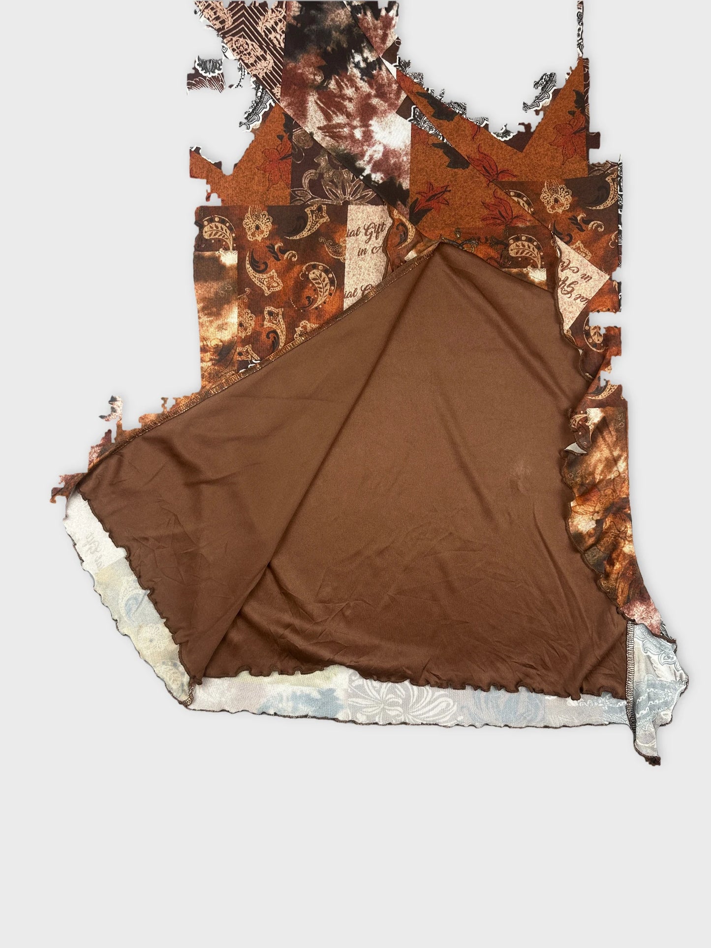 Detail view of brown vintage skirt featuring a patchwork design.