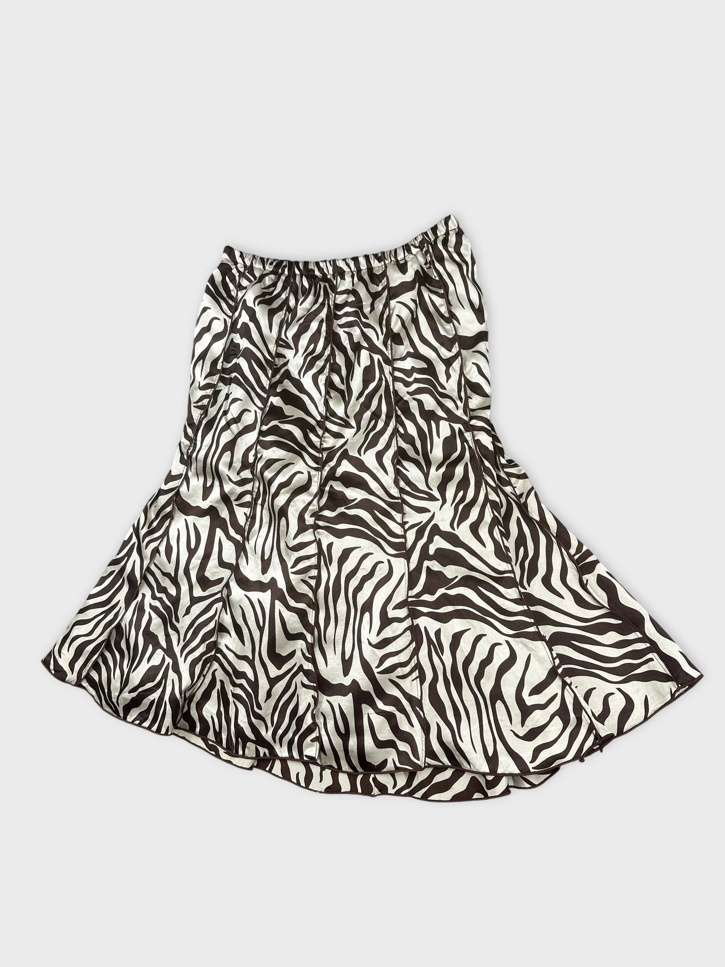 Detail view of a skirt featuring a black and white zebra print pattern.