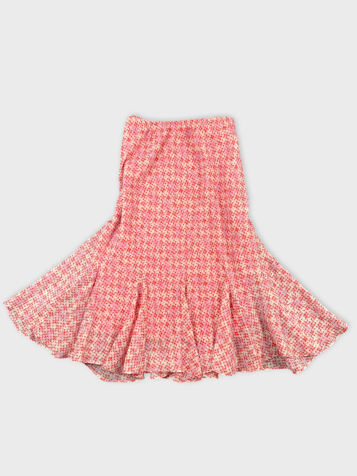 Flared skirt in pink with a checkered pattern detail view.