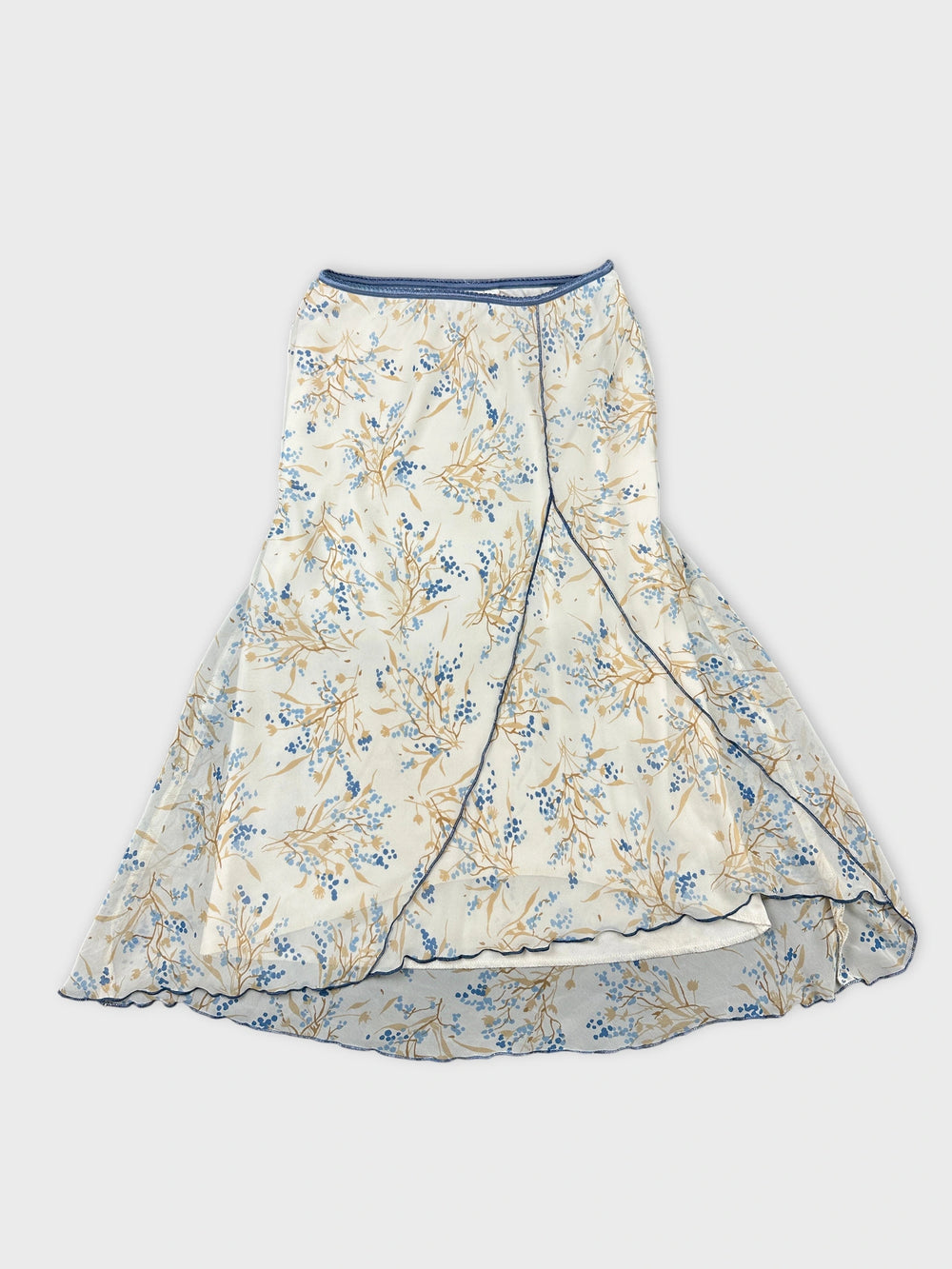 Front view of a floral print skirt in cream and blue colors.
