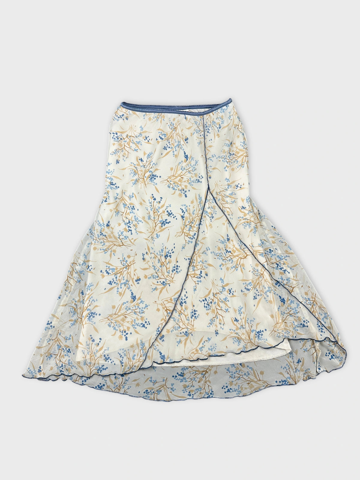 Front view of a floral print skirt in cream and blue colors.