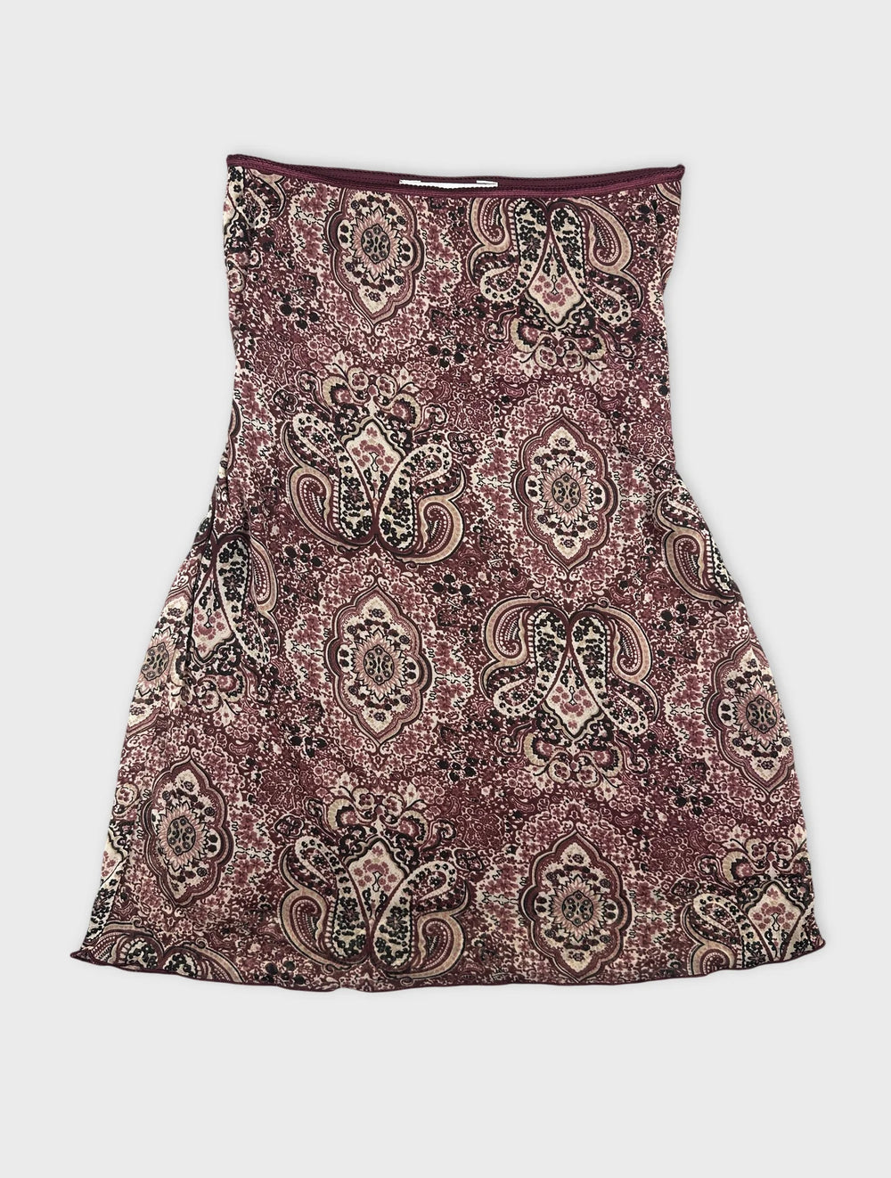 Front view of a maroon skirt featuring a paisley pattern.