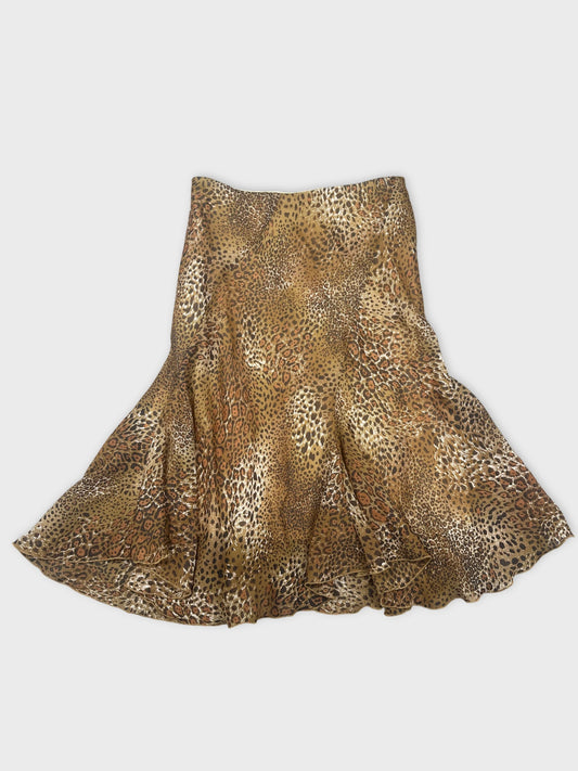 Front view of a brown leopard print skirt with flared hem.