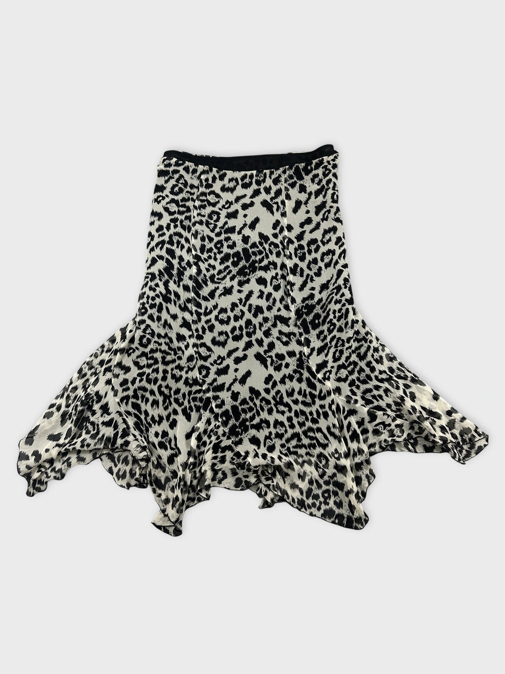 Front view of a flared leopard print skirt in black and cream.