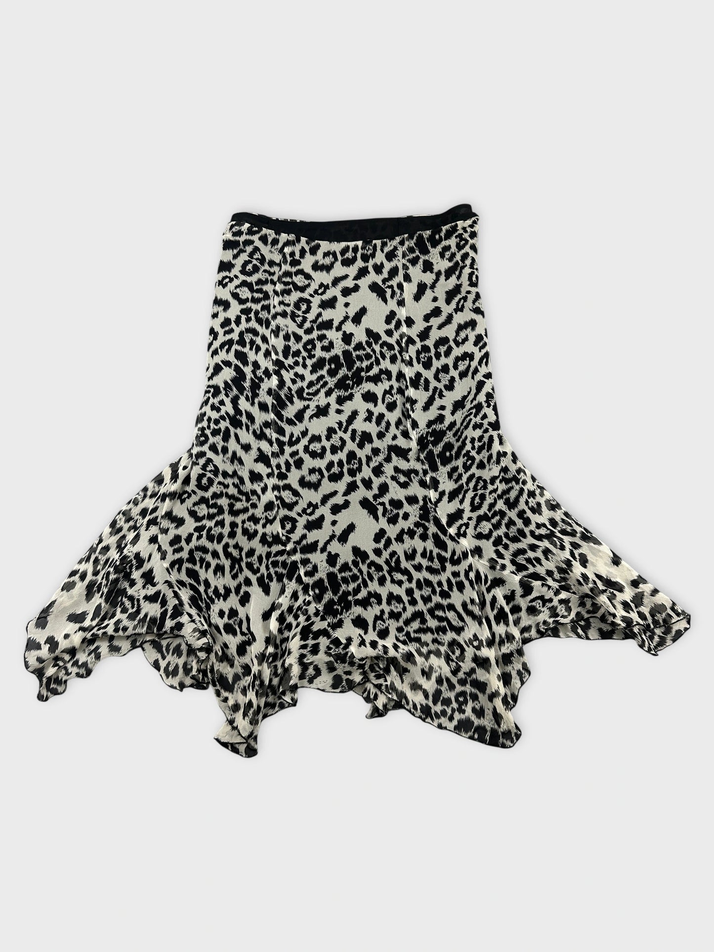 Front view of a flared leopard print skirt in black and cream.