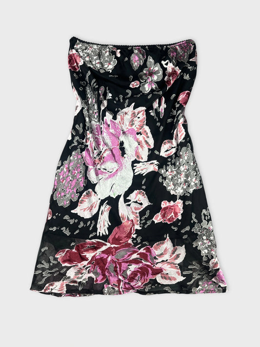 Front view of a black floral skirt with large pink roses.