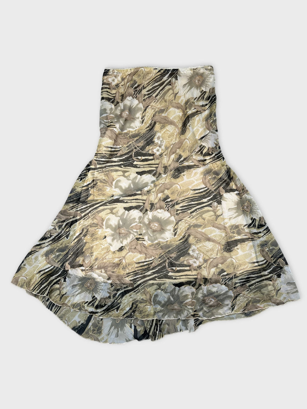 A floral printed skirt in beige and black colors front view.