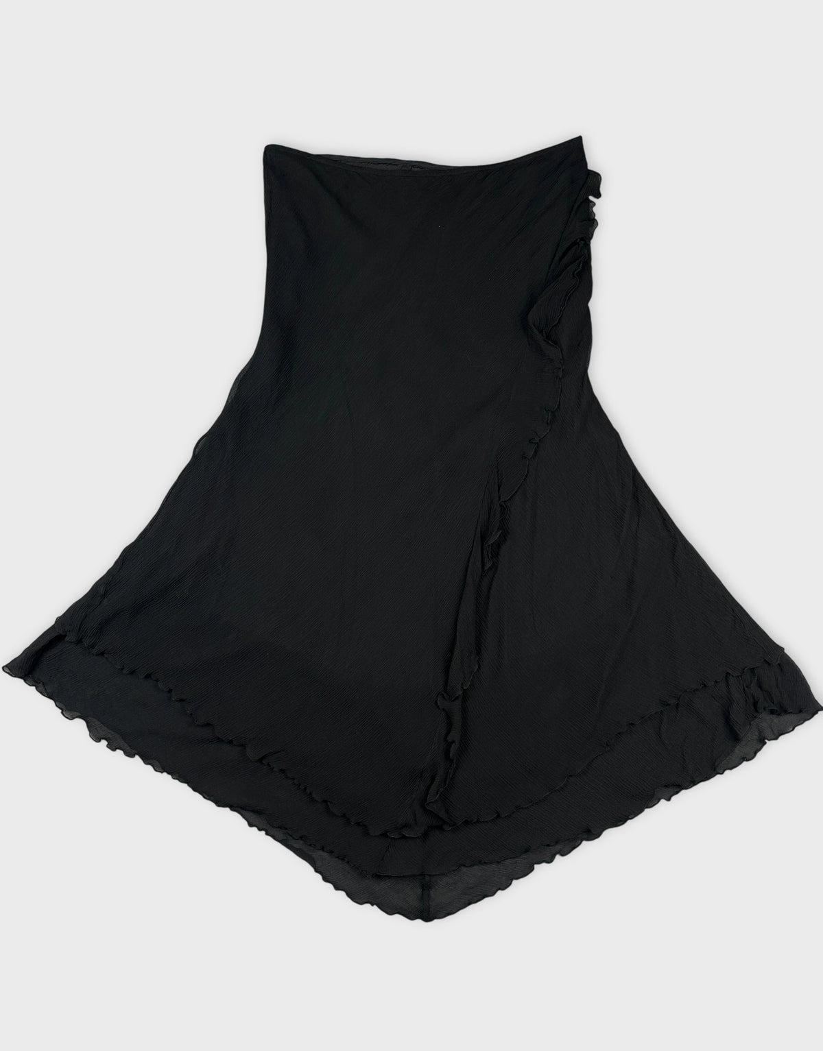 Black skirt with ruffled hem shown in front view.