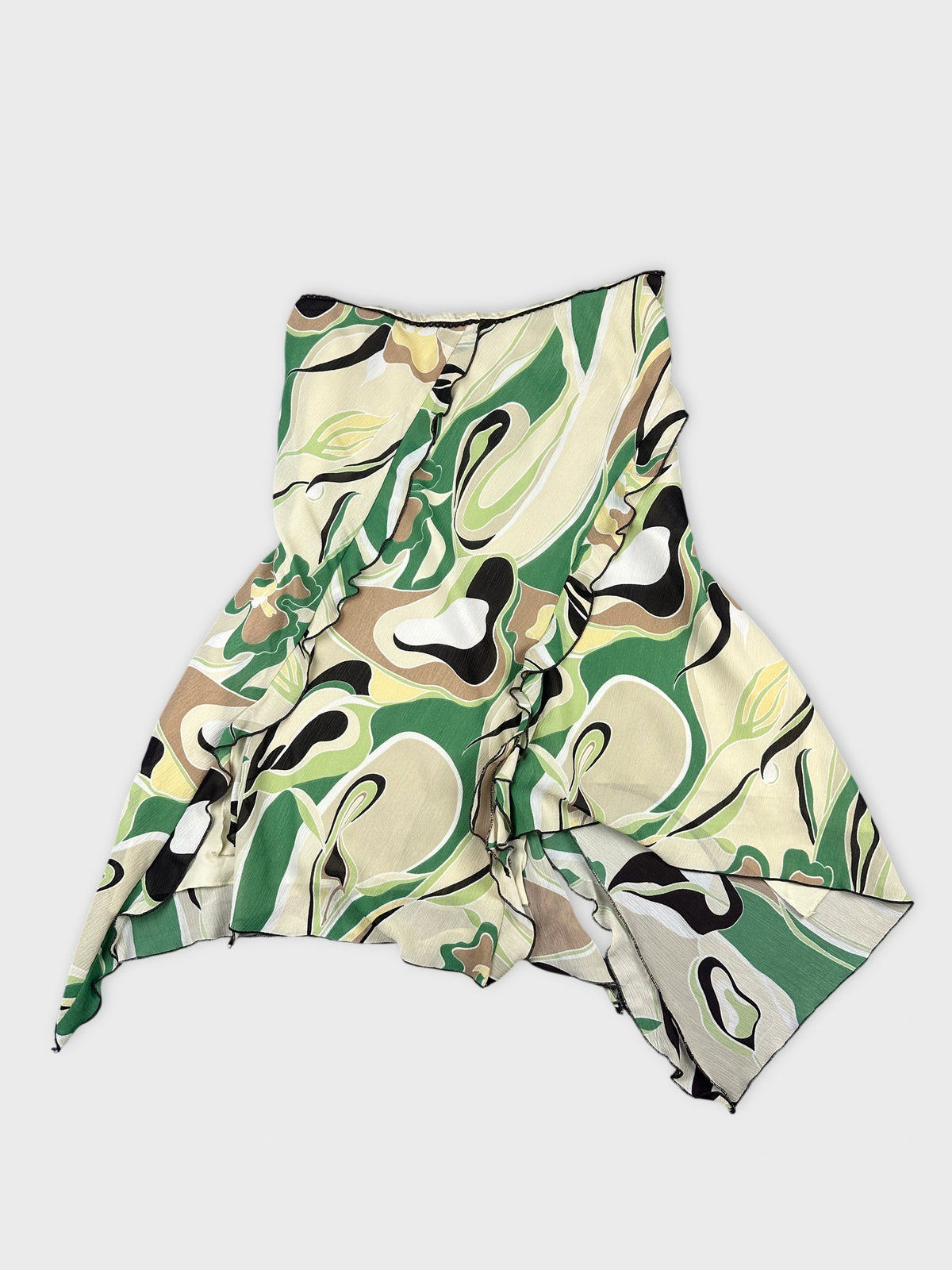 Front view of a flowing skirt in green and beige swirl pattern.