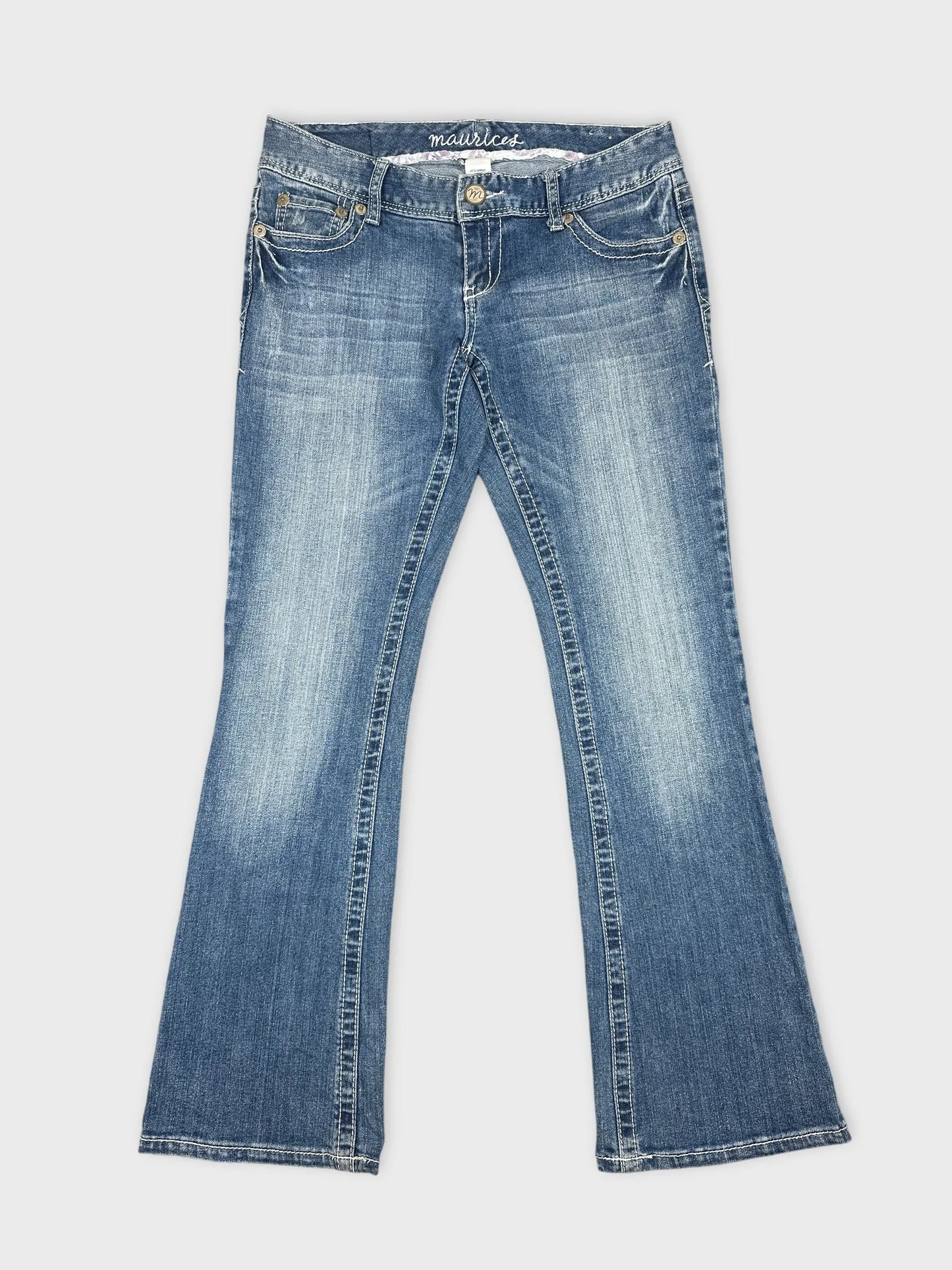 Front view of women denim jeans in light blue with flared shape