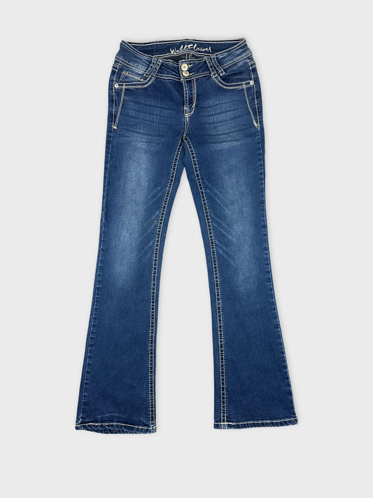 Front view of women denim jeans in dark blue with flared shape.