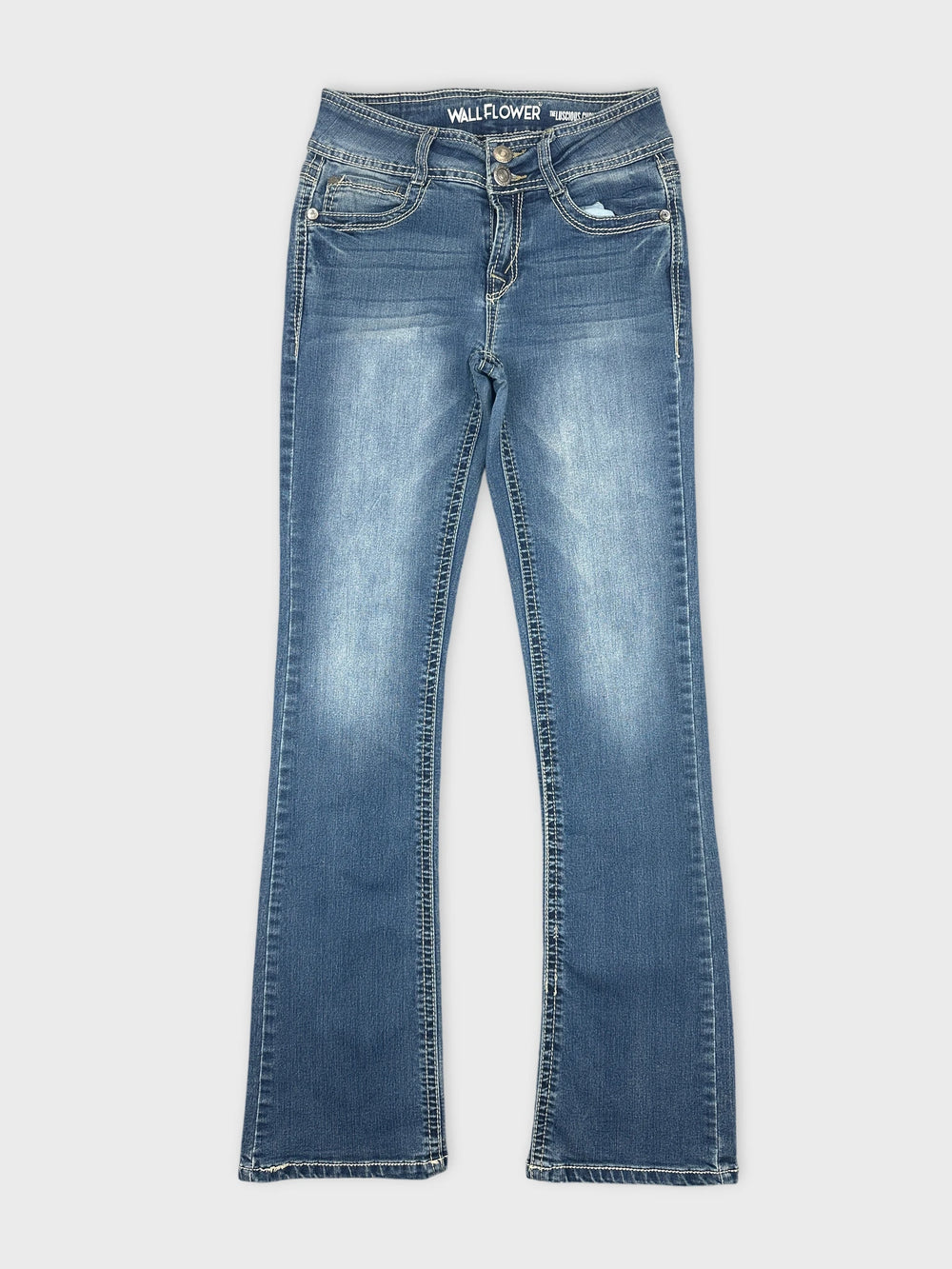 Front view of blue denim jeans featuring a slightly faded finish
