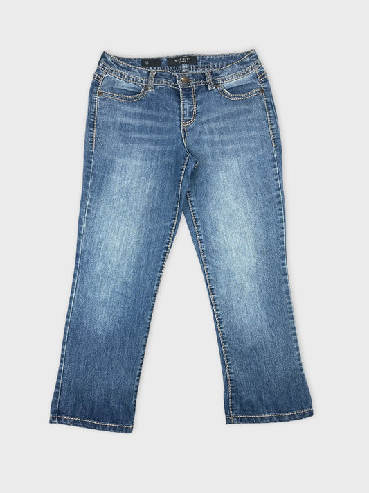 Front view of blue denim jeans featuring classic stitching details.