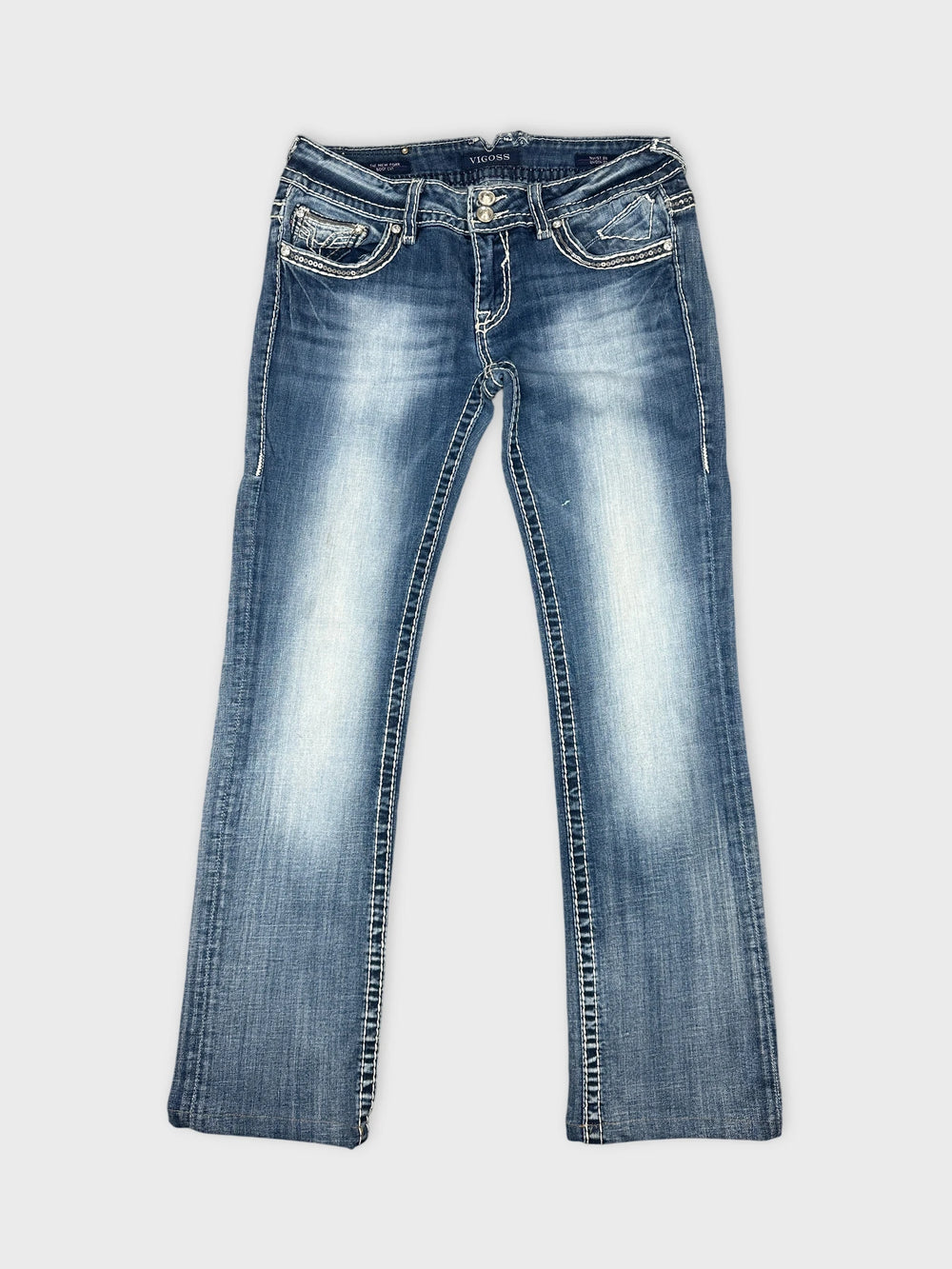 Front view of blue denim jeans with decorative stitching and pockets.
