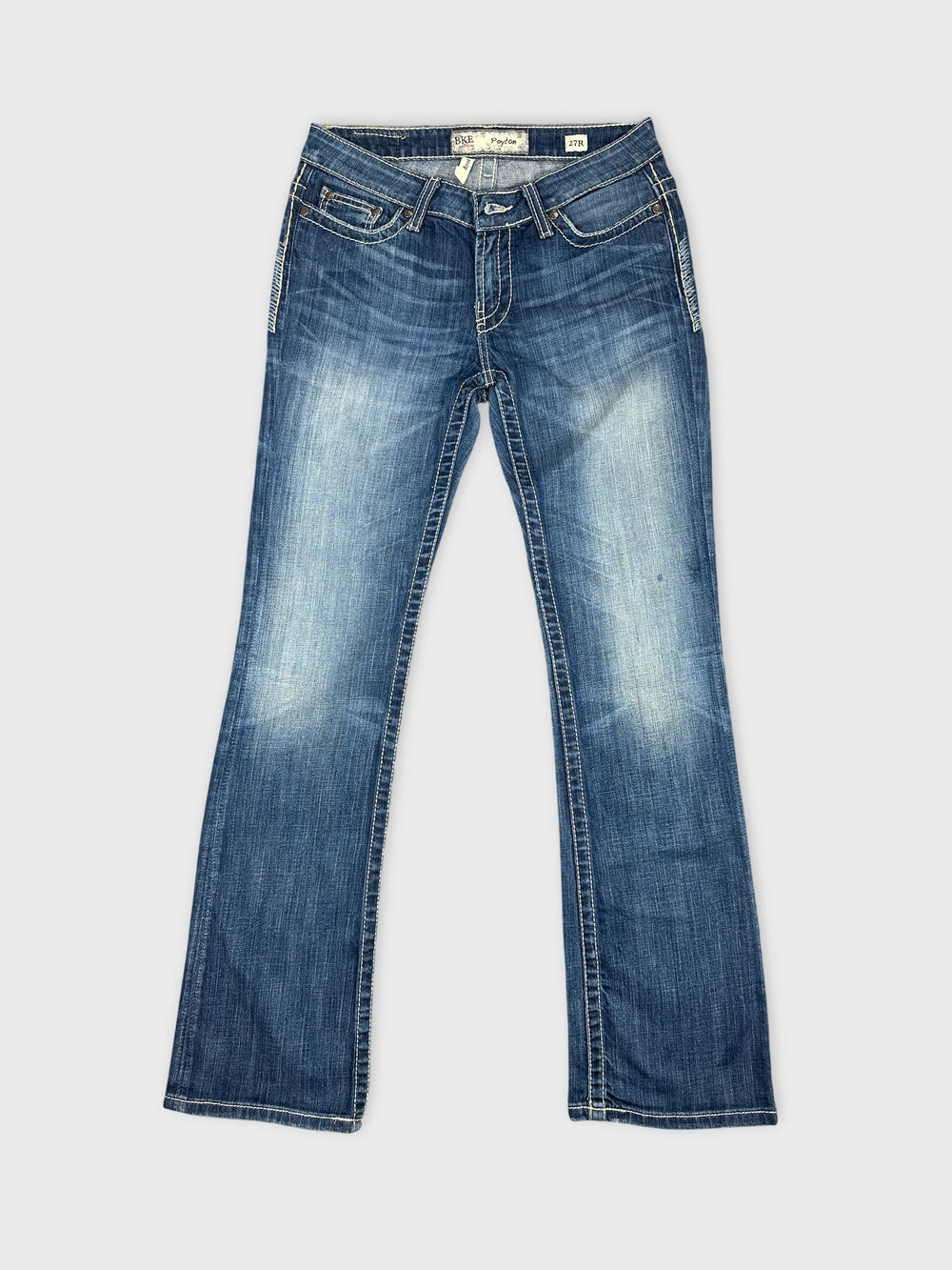 Front view of women denim jeans in dark blue with light fading.