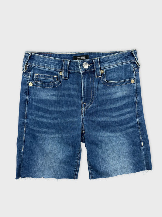Front view of women denim midi shorts in dark blue with frayed hem.