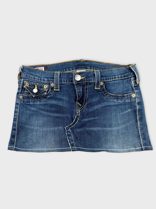 Front view of a blue denim shirt featuring a button closure and pockets.