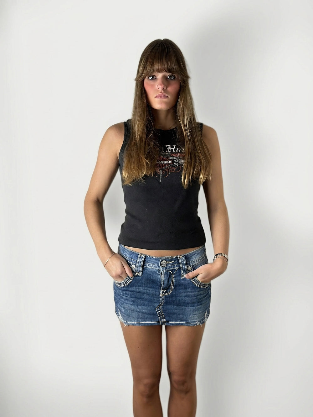 Front view of a blue denim shirt featuring a graphic print.