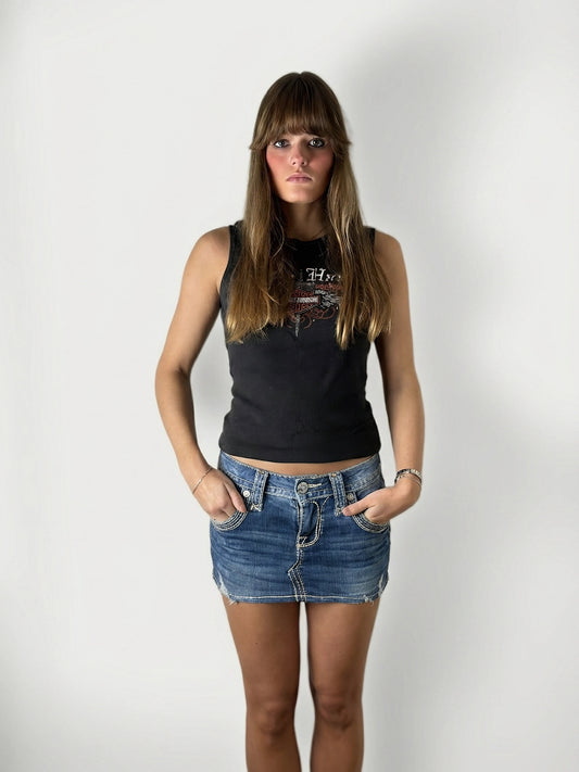 Front view of a blue denim shirt featuring a graphic print.
