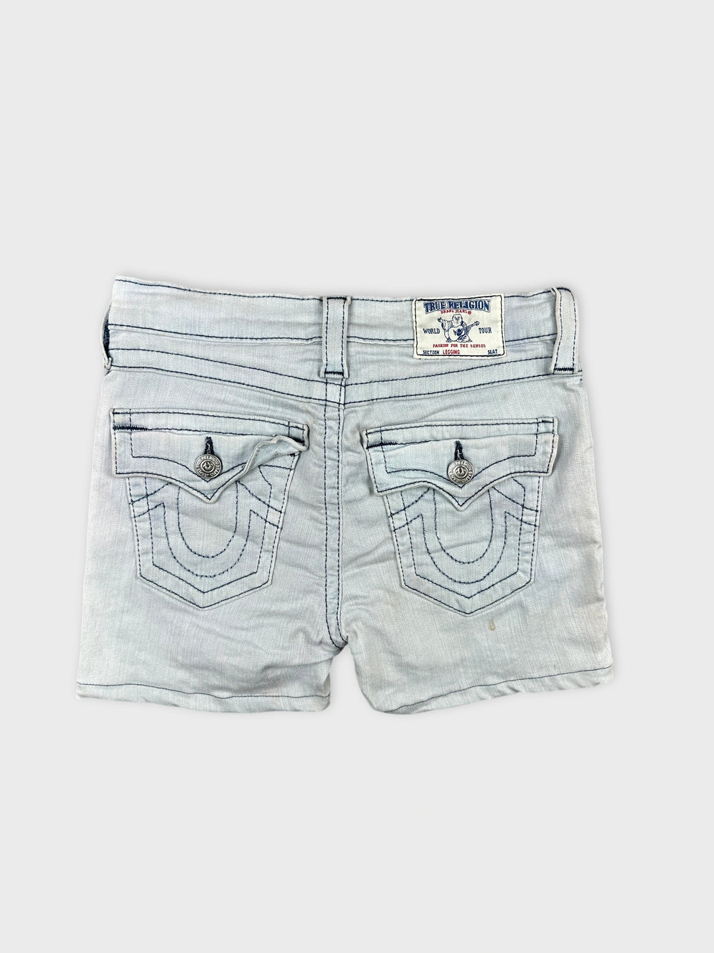 Back view of light blue denim shorts featuring decorative stitched pockets.