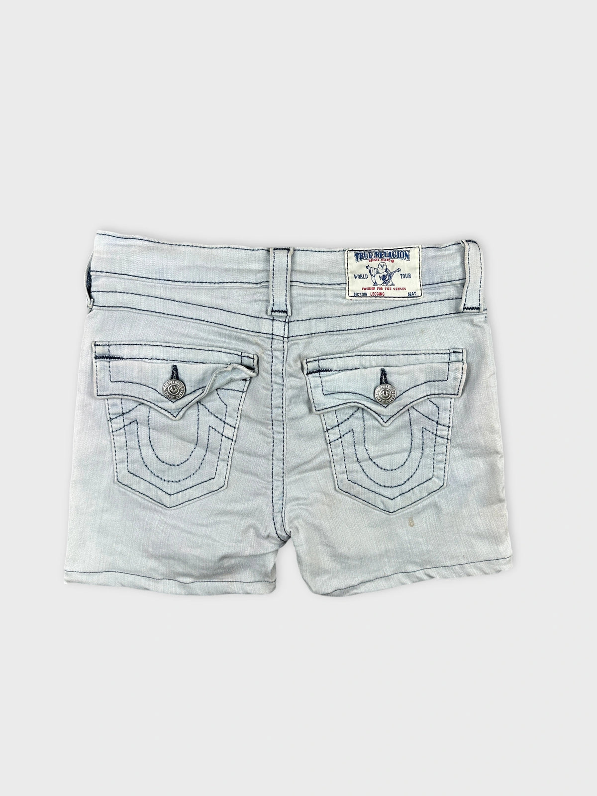 Back view of light blue denim shorts featuring decorative stitched pockets.