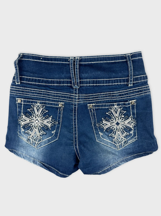 Back view of blue denim shorts with embroidered detailing on pockets.