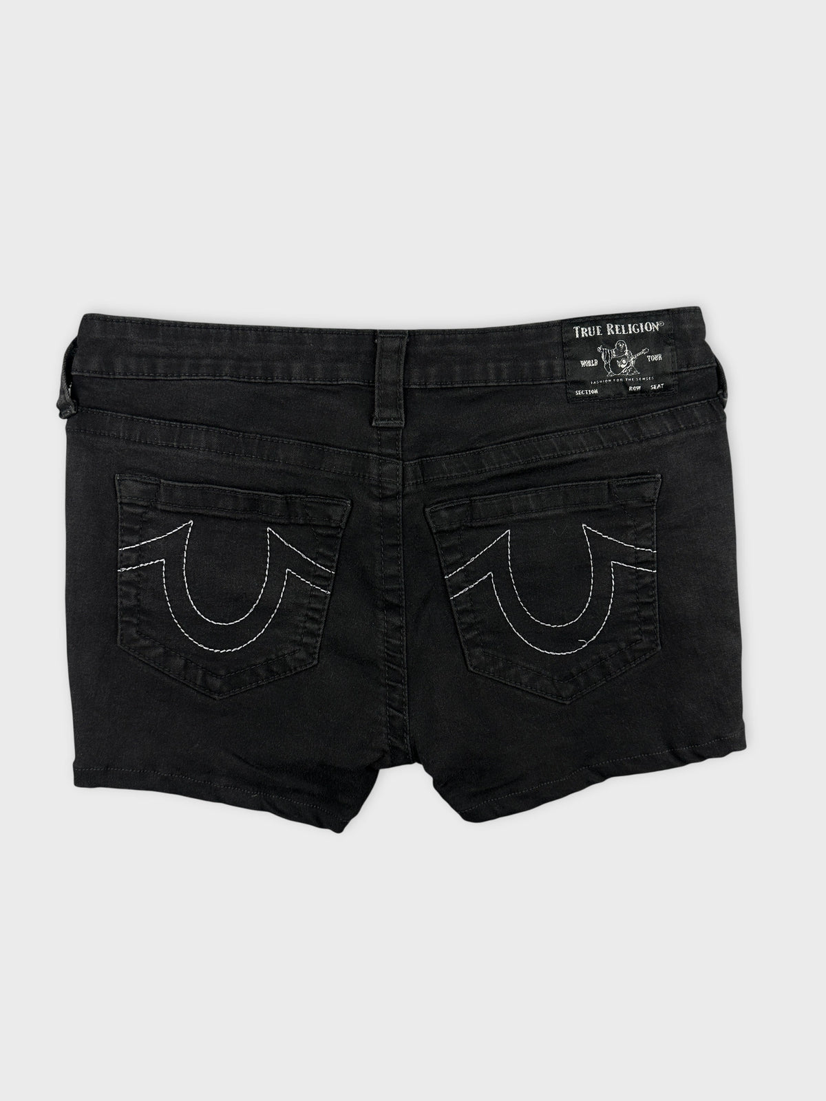 Back view of women denim shorts in black featuring decorative stitching on pockets.