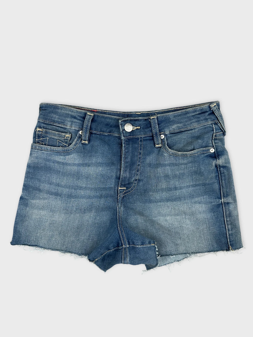 Front view of blue denim shorts with frayed hem and pockets.