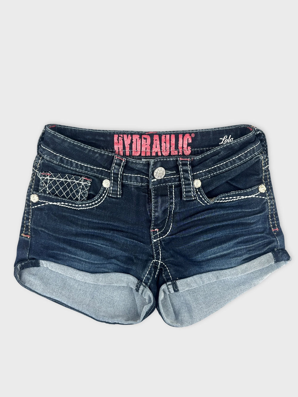Front view of dark denim shorts with light blue rolled hem and decorative pocket stitching.