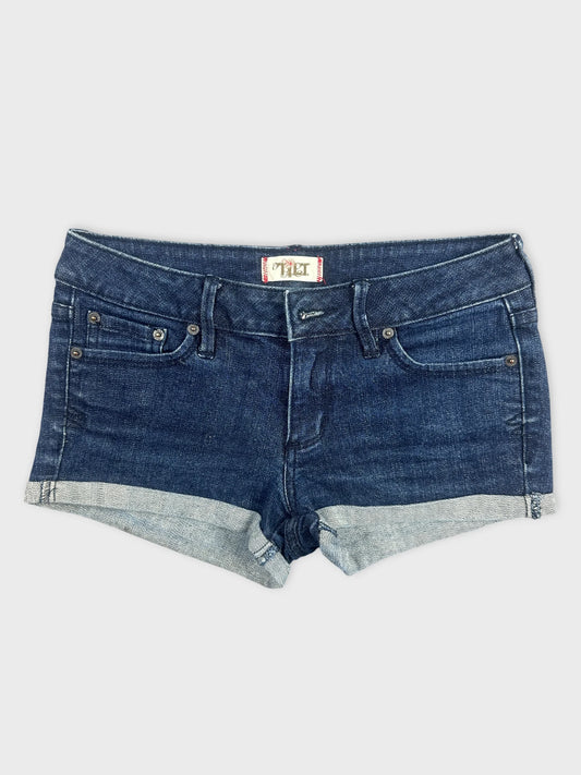 Front view of dark blue denim shorts with a cuffed hem.
