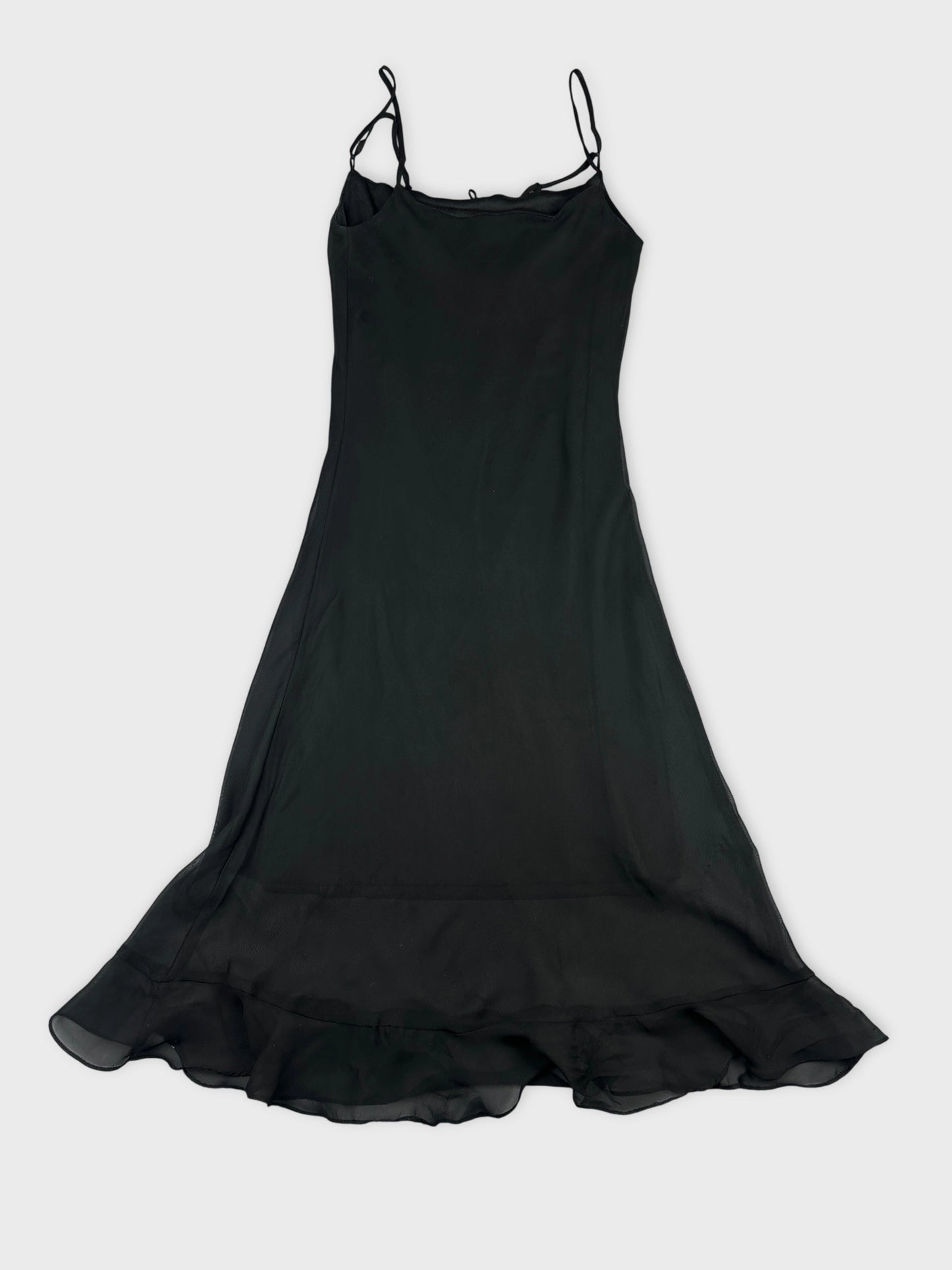 Back view of a black long dress with a ruffled hem