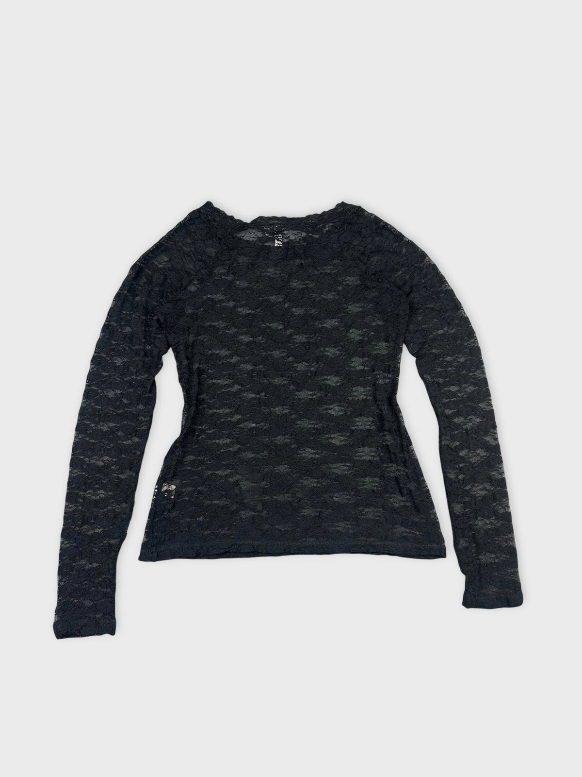Back view of a black long sleeve blouse with textured lace detailing.