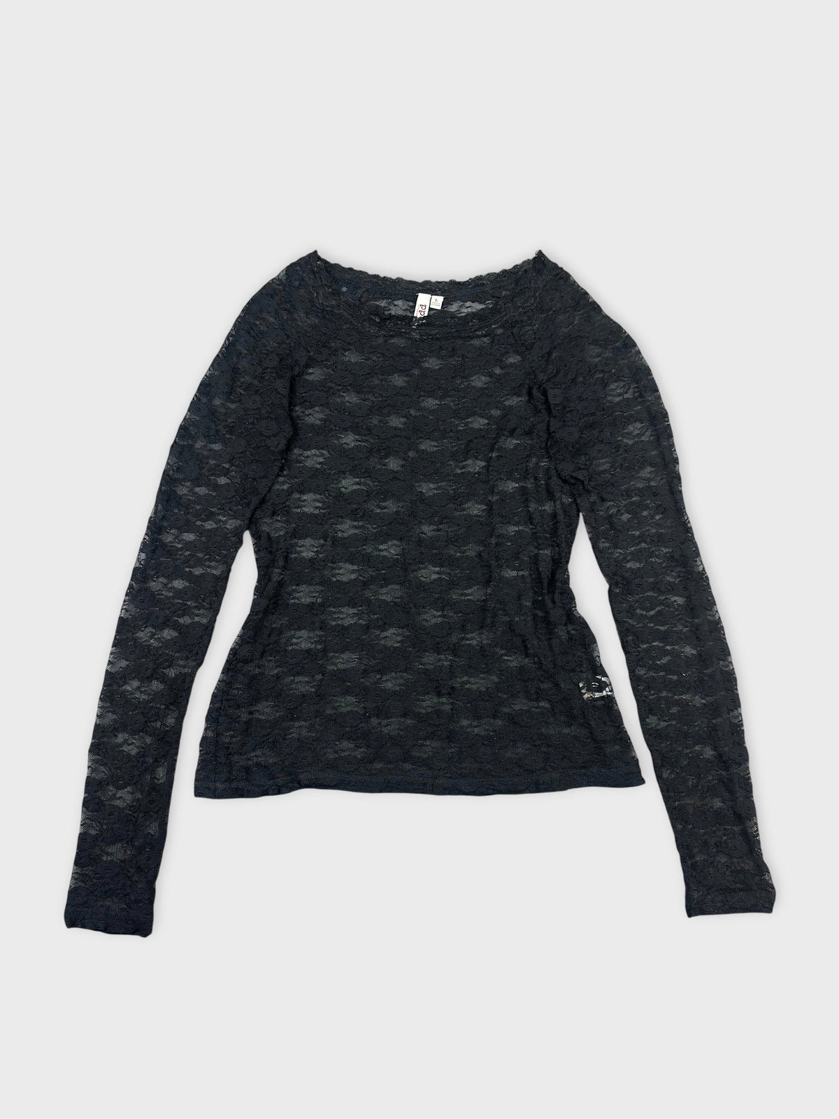 Front view of a black long sleeve blouse featuring a lace pattern.