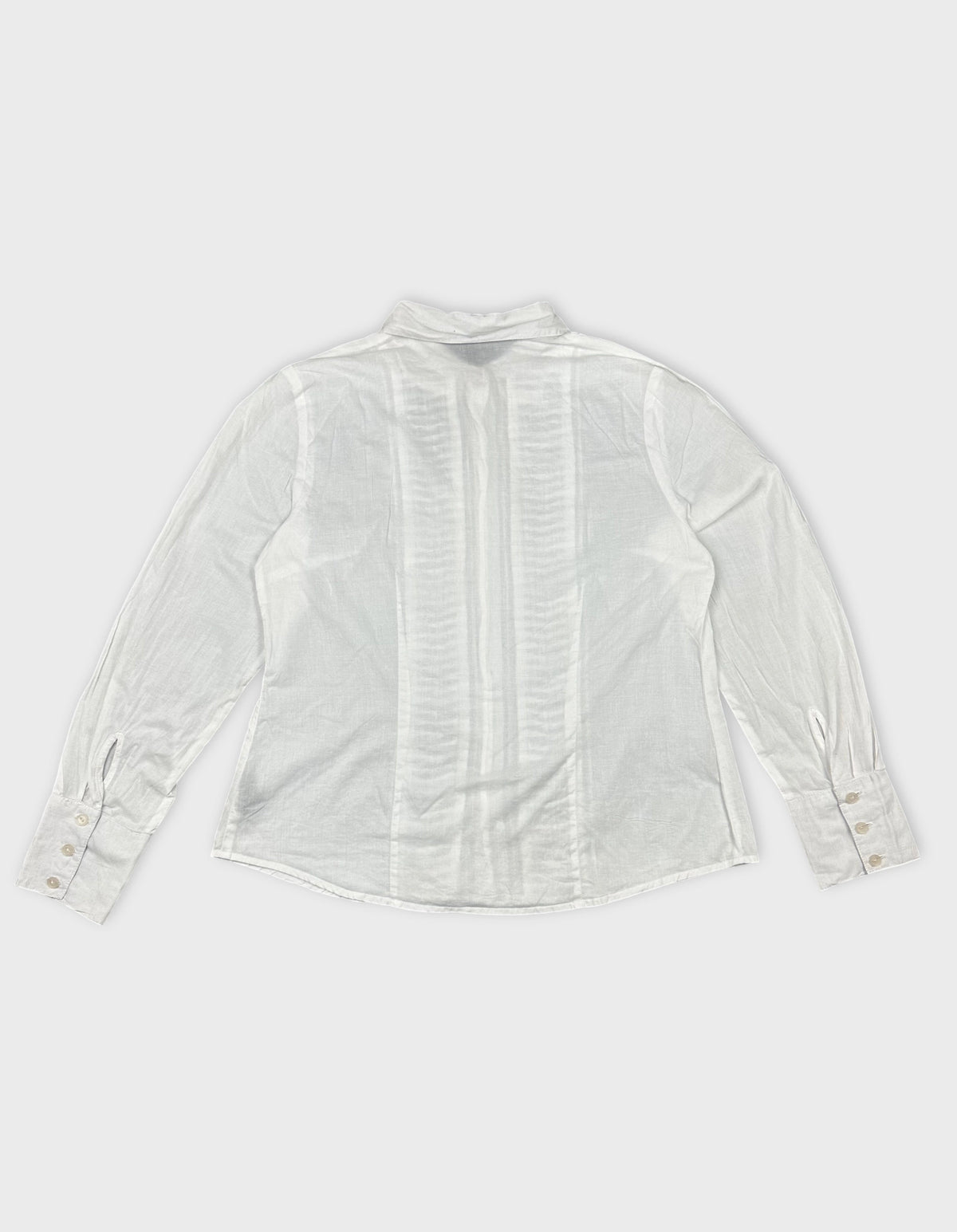 Back view of a white long sleeve button up shirt with pleated design