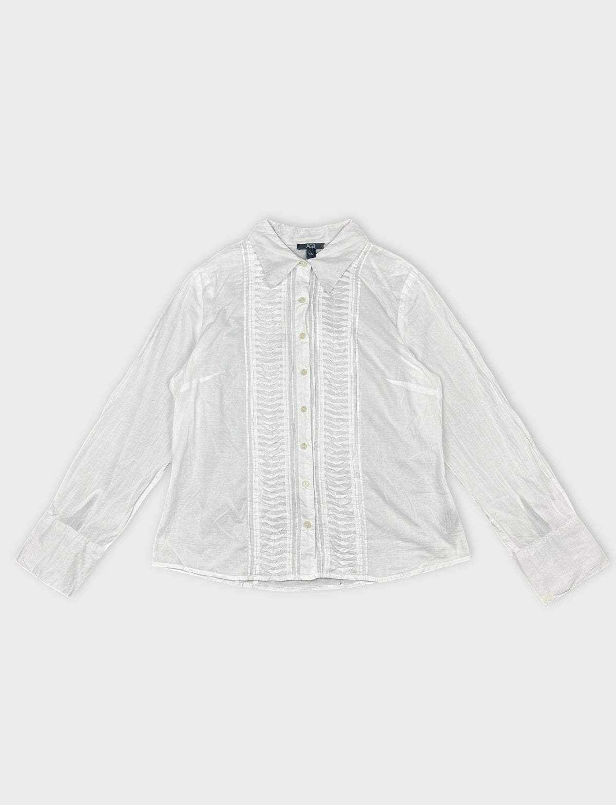 Front view of a white long sleeve button up shirt with pintuck detailing.