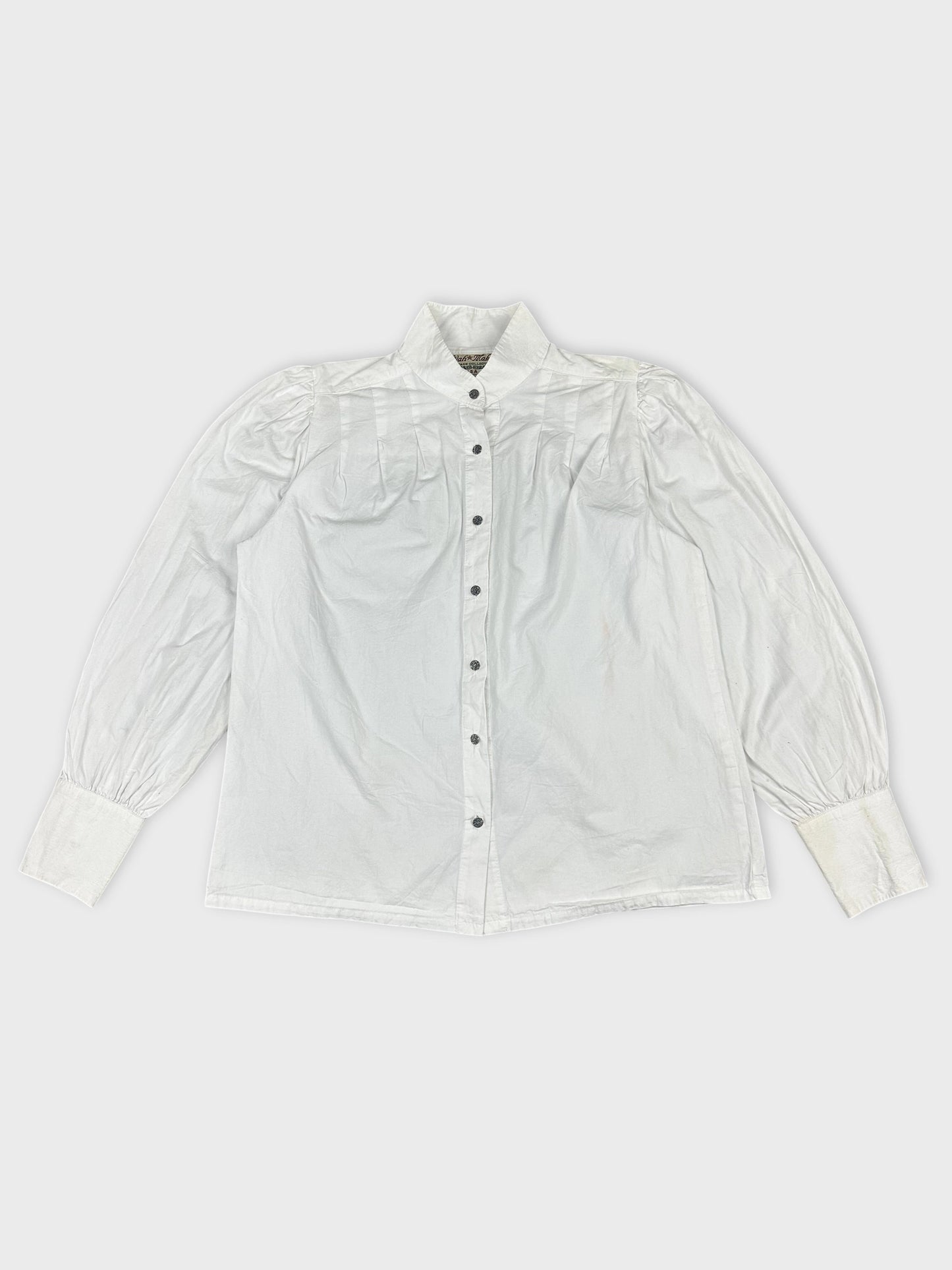 Front view of a white long sleeve button-up shirt with pleated shoulders.