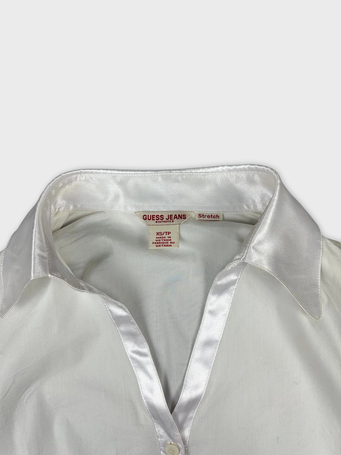 Back view of white long sleeve shirt with satin collar
