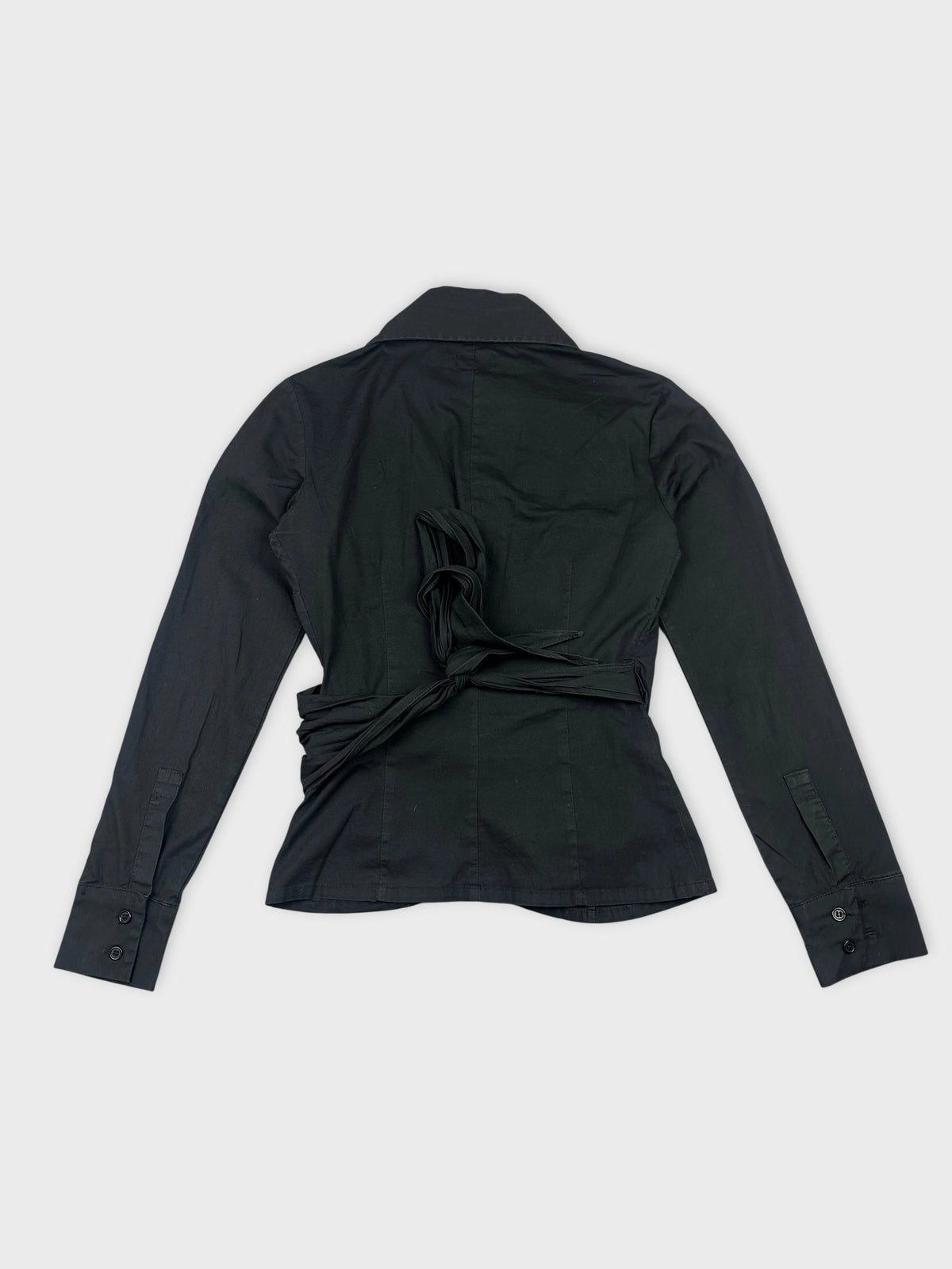 Black long sleeve shirt with a tied detail at the back view.