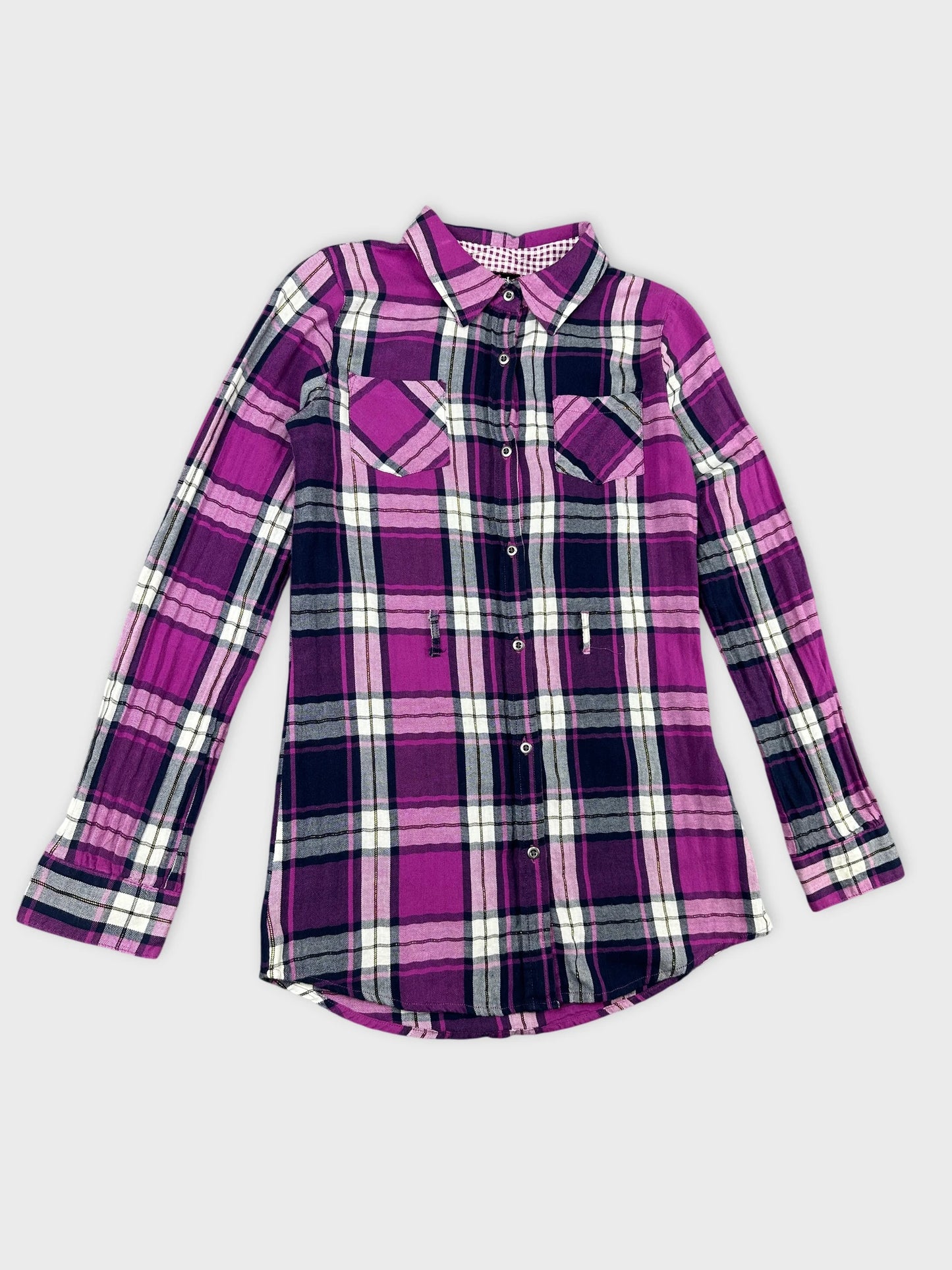 Detail view of a long sleeve plaid shirt in purple and black.