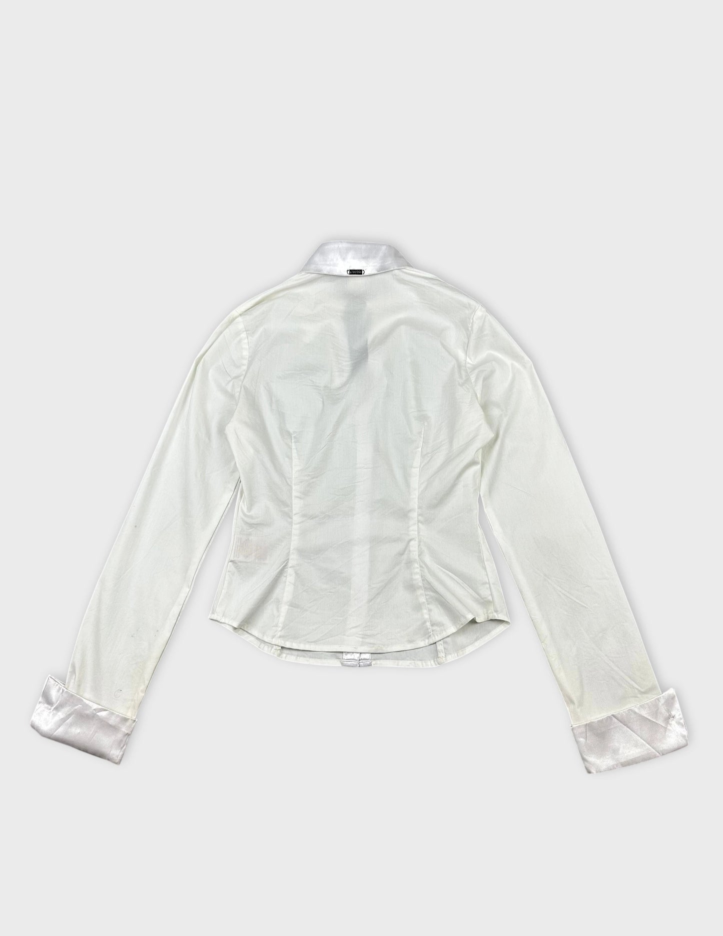 detail view of a white long sleeve shirt with satin collar