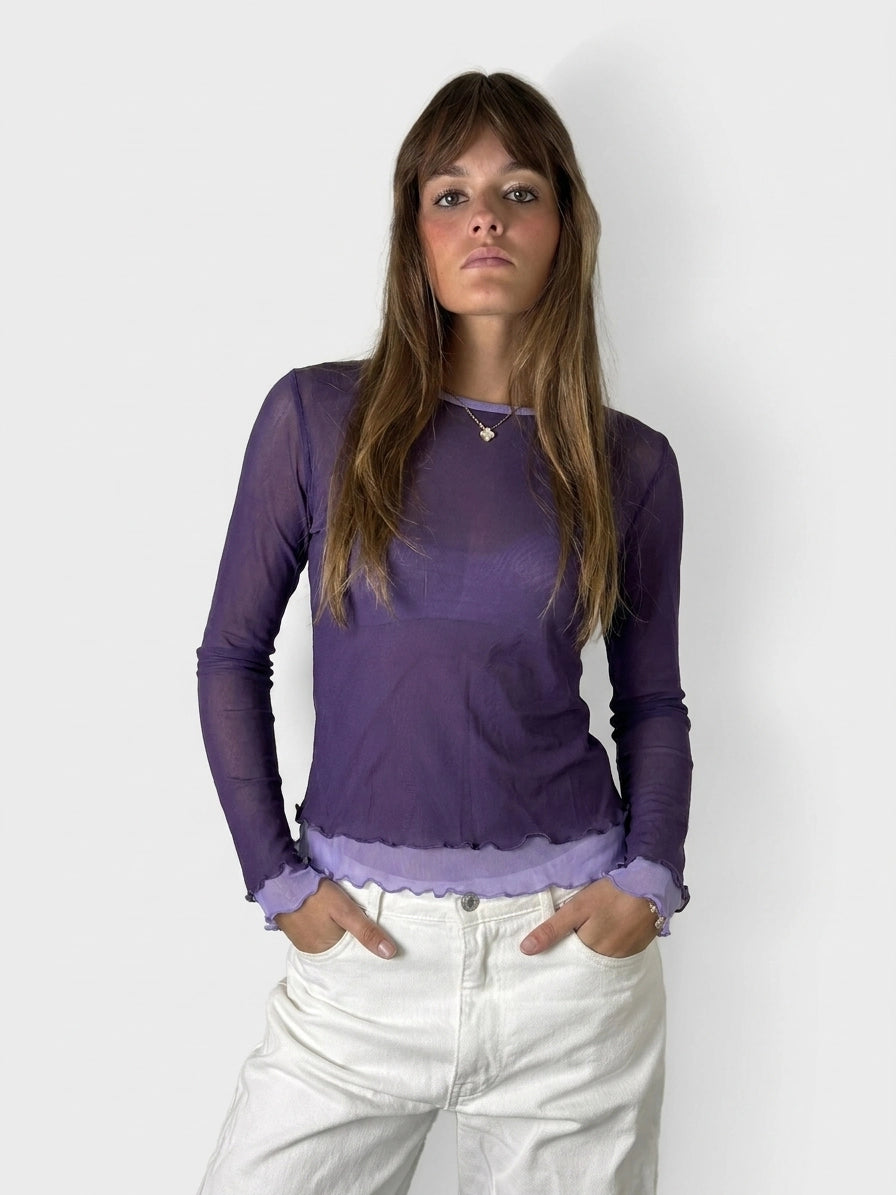 Front view of a purple long sleeve shirt with ruffled trim.