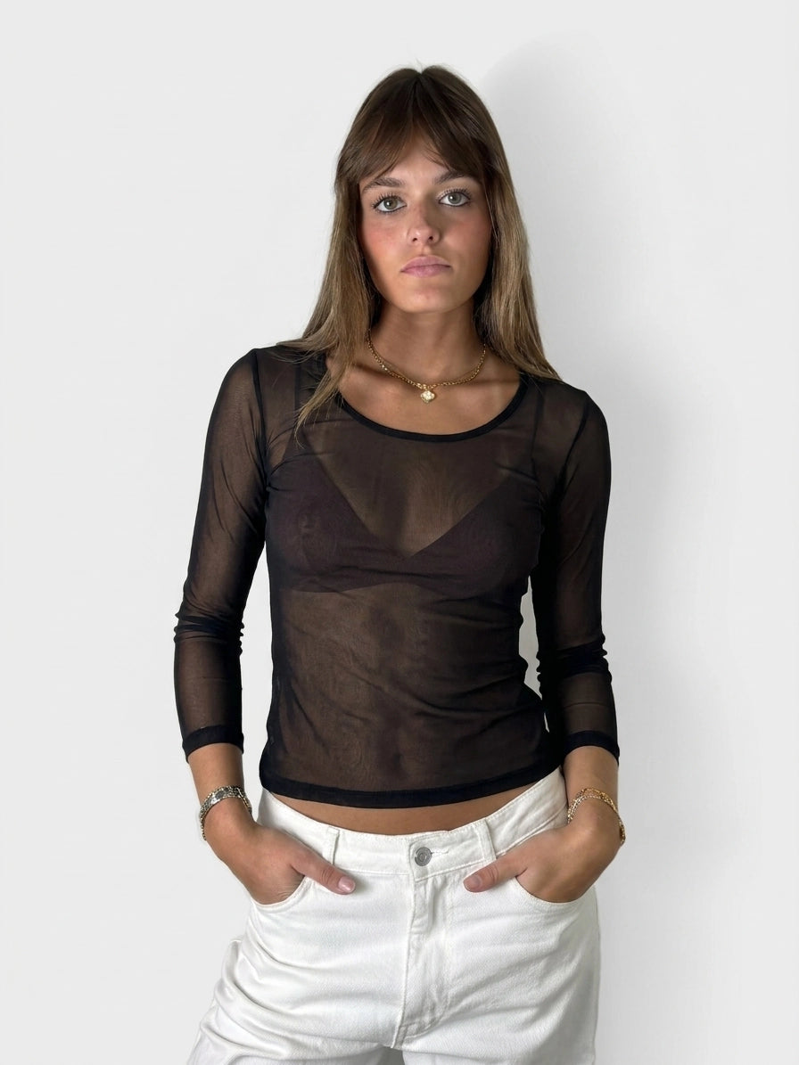Black long sleeve shirt with sheer texture, front view.