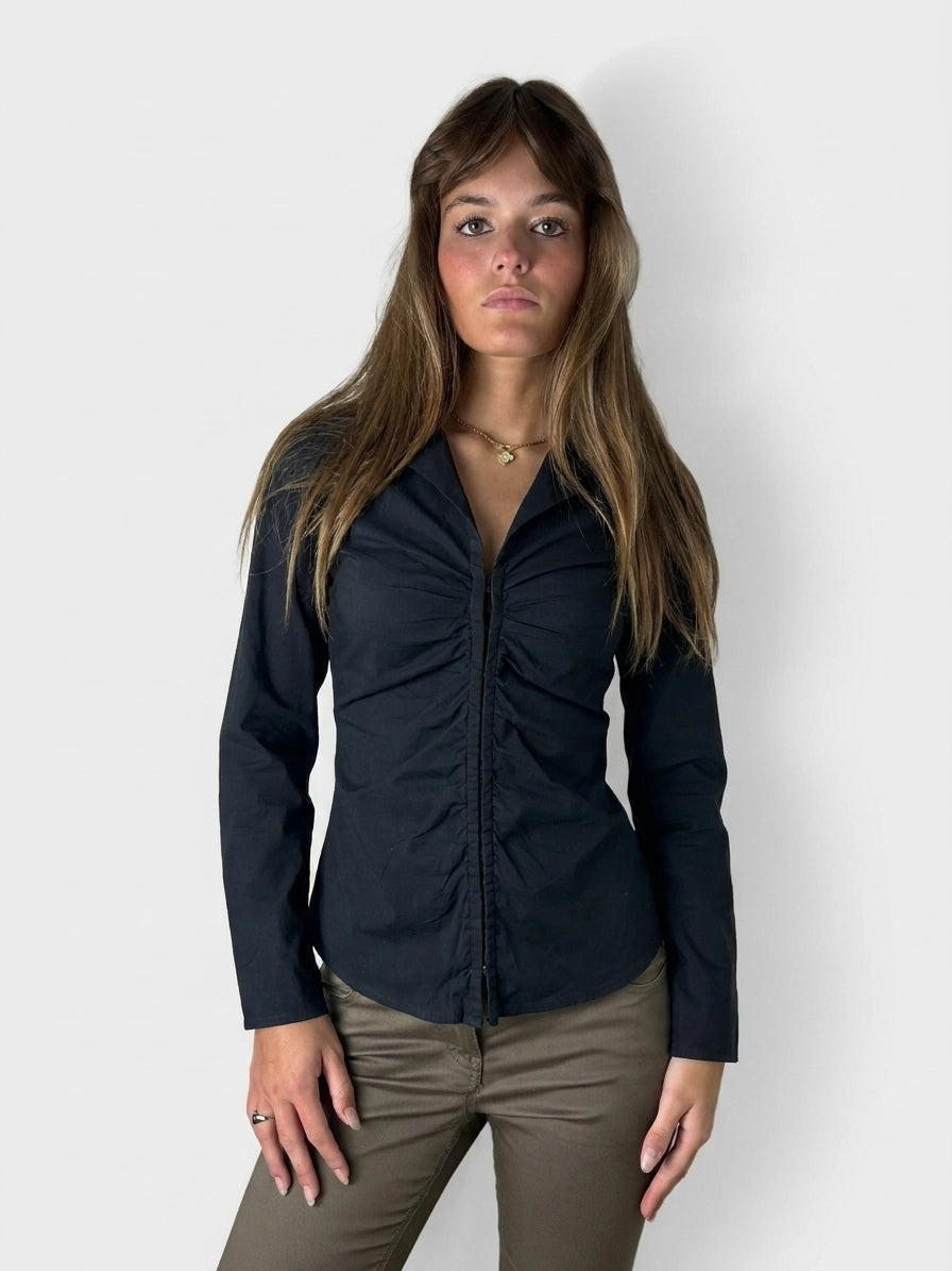 Women long sleeve shirt in black with gathered front detail, front view.