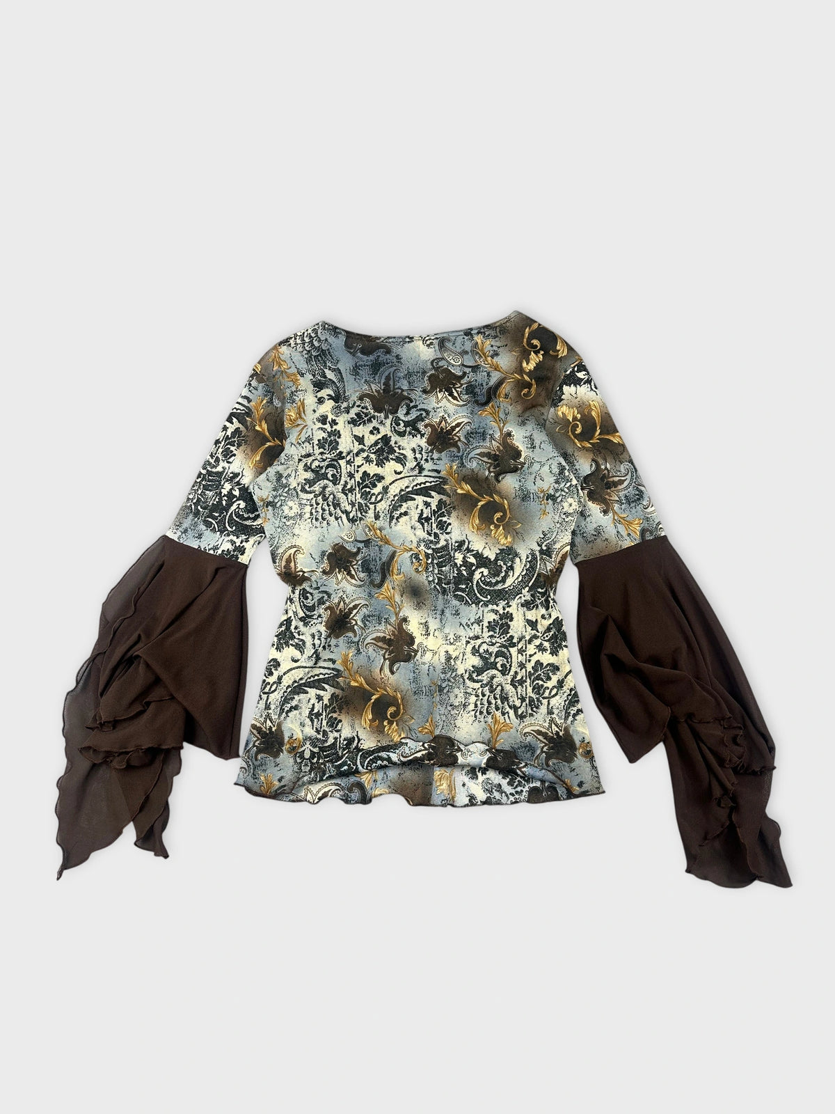 Back view of a long sleeve top featuring a floral pattern in blue and gold.