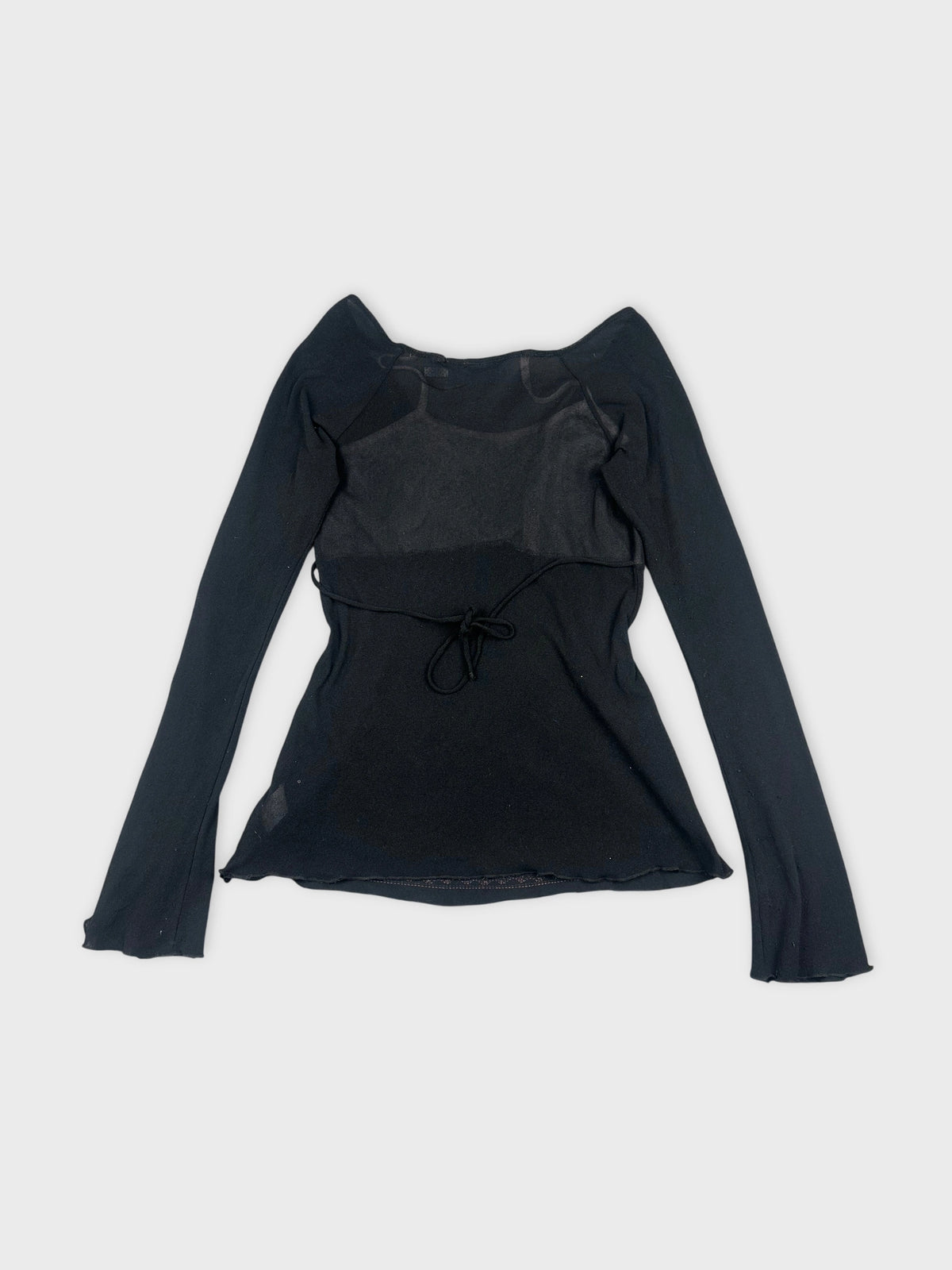 Back view of a black long sleeve top featuring a tie detail.