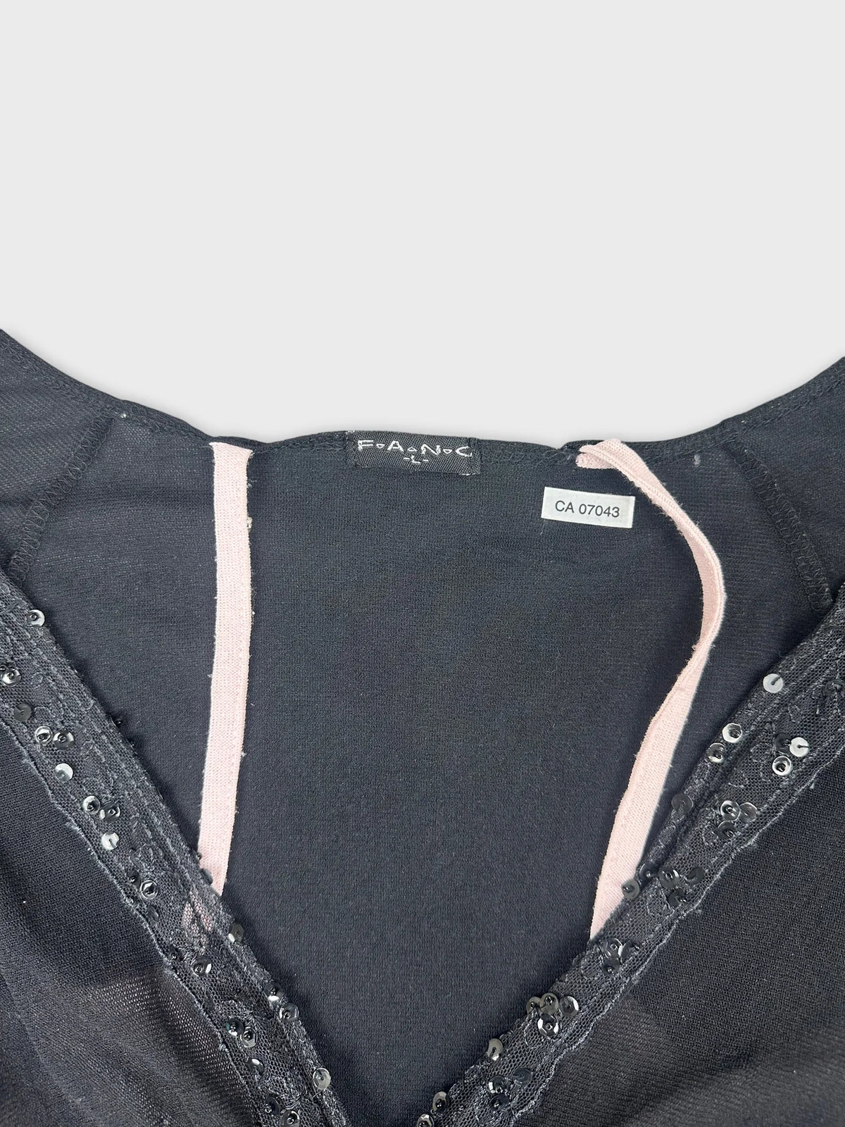 Long sleeve top in black with lace trim detail view