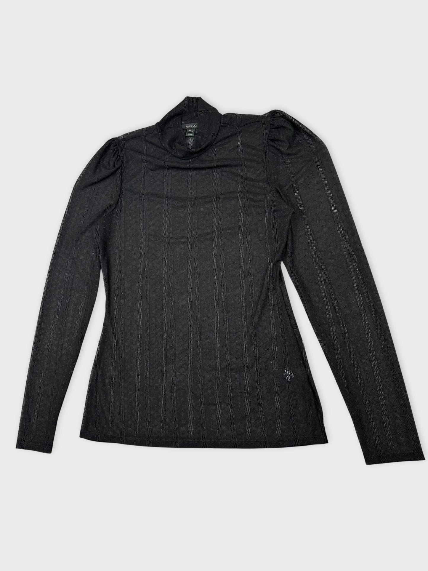 Detail view of a black long sleeve top with textured vertical stripes.