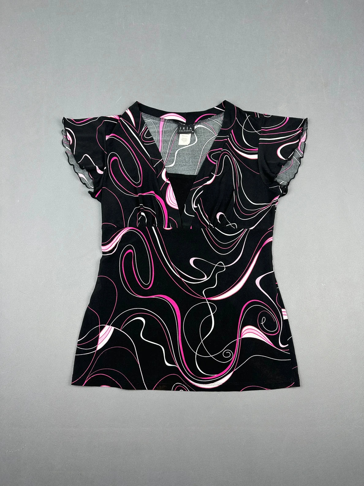 Front view of a black short sleeve shirt with pink abstract swirl pattern.