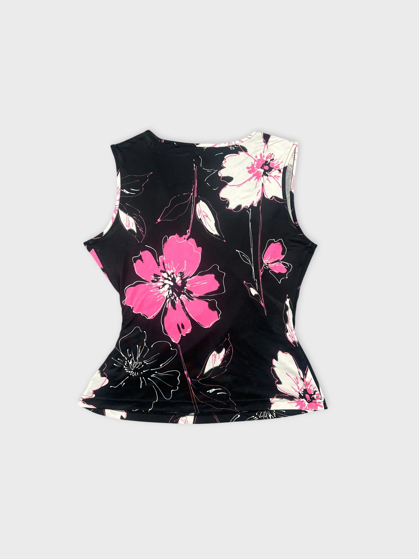Back view of a floral print black short top with pink flowers.