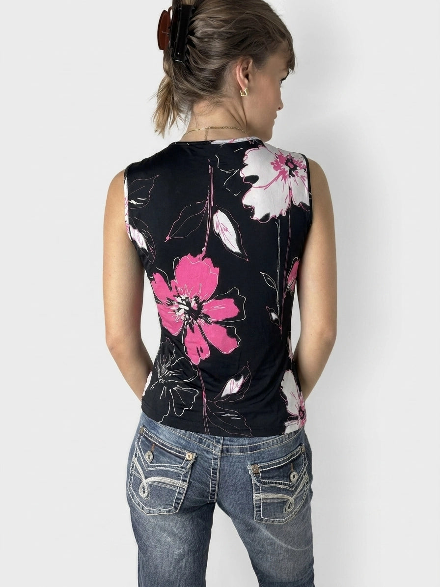 Back view of a black sleeveless top with pink floral pattern.